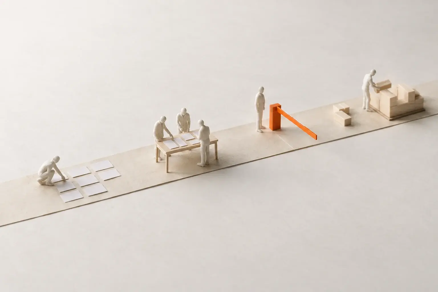 A paper model of a straight track where figures lay out and review the plan, pass an orange approval gate, then build.